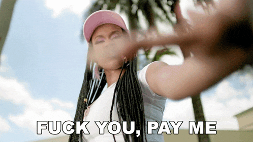 a woman with braids and a pink hat says fuck you pay me
