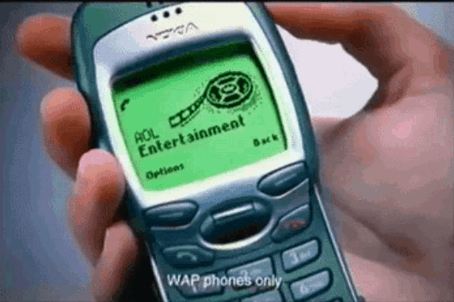 a person is holding a phone that says wap phones only on the screen