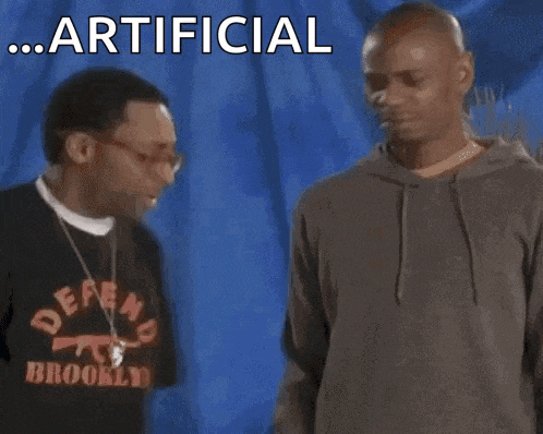 two men standing next to each other with the words " artificial gimme some "