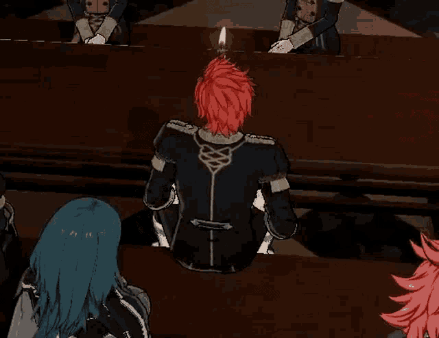a man with red hair is sitting in front of a table with a candle