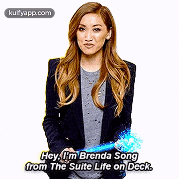a woman is holding a blue object and saying `` hey , i 'm brenda song from the suite life on deck .
