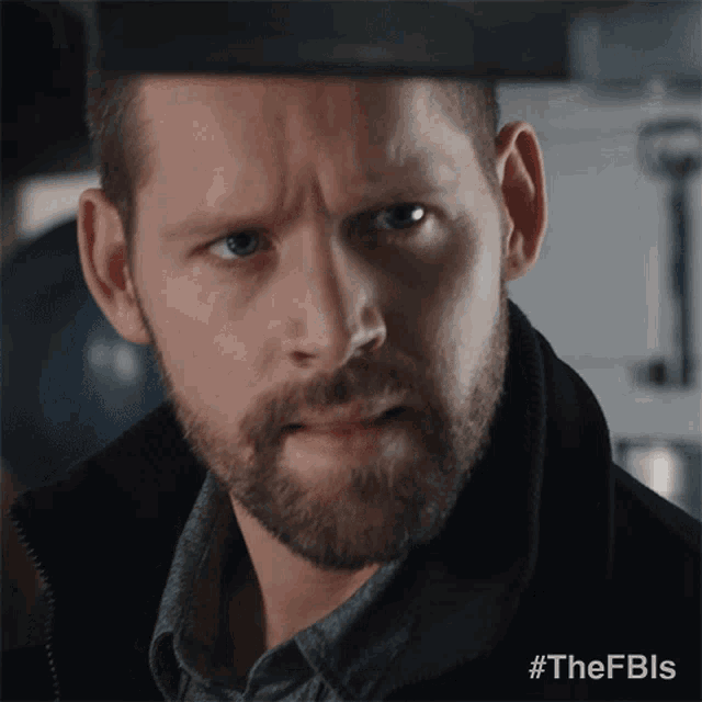 a man with a beard looks at the camera with the hashtag #thefbls