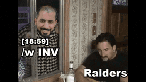 two men are looking out of a window and one of them is a raider