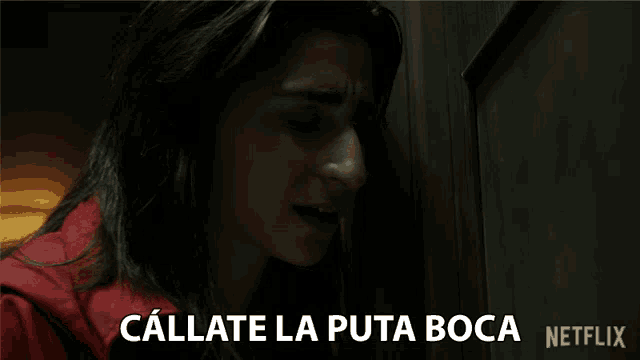 a woman in a red jacket says callate la puta boca in spanish