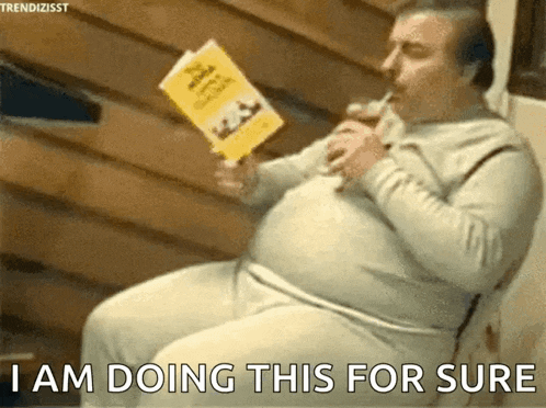a man is reading a book and drinking from a straw and says i am doing this for sure .