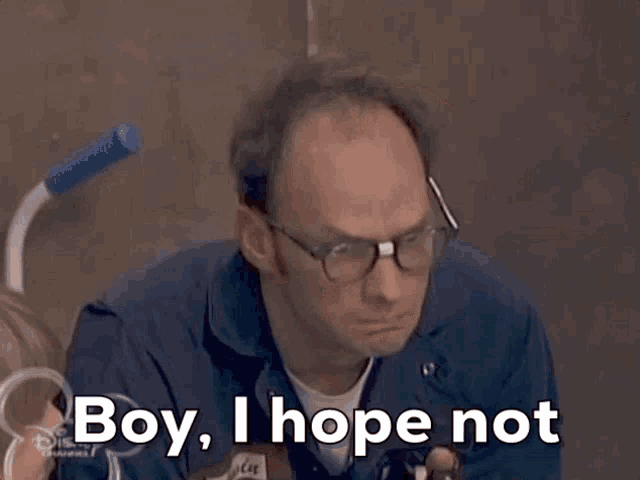 a man with glasses says boy i hope not in front of a disney logo