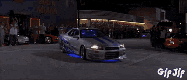 a gif of a monkey sitting in a car with the words gif jif on the bottom
