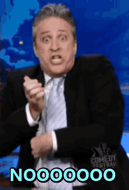 a man in a suit and tie is making a funny face with the word nooo on the bottom
