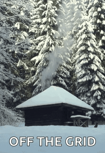 a picture of a snowy cabin with the words off the grid above it