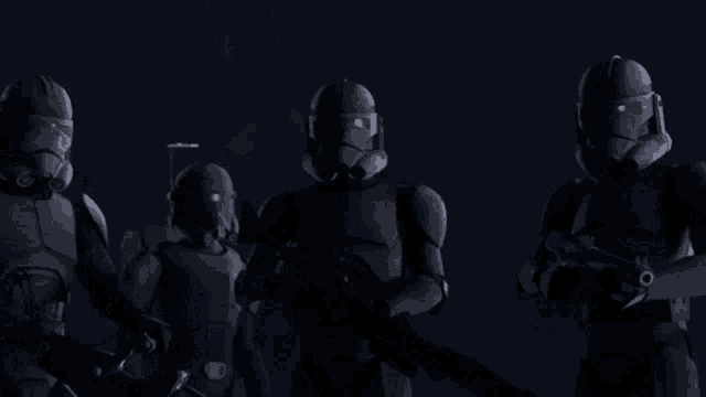 a group of clone trooper soldiers are standing in the dark