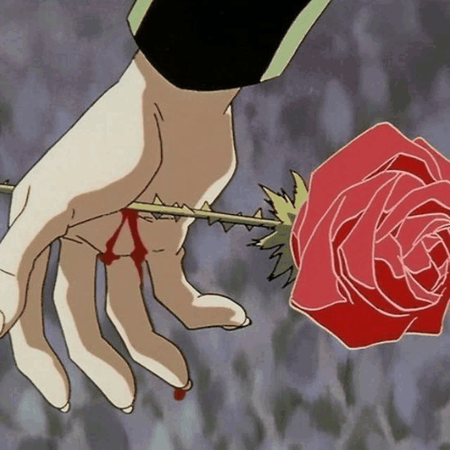a bloody hand is holding a red rose
