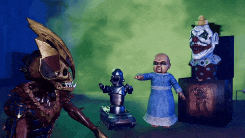 a group of toys including a robot and a clown are standing next to each other