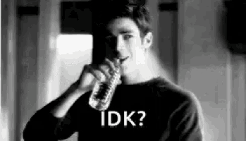 a black and white photo of a man drinking water from a bottle and asking idk .