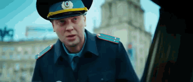 a man in a military uniform has a badge that says ' o ' on it