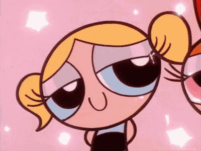 bubbles and buttercup from the powerpuff girls are looking at each other .