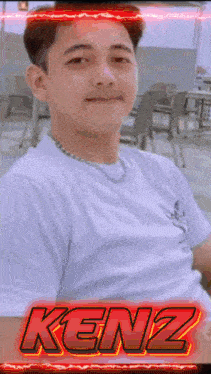 a man in a white shirt with the name kenz written on it