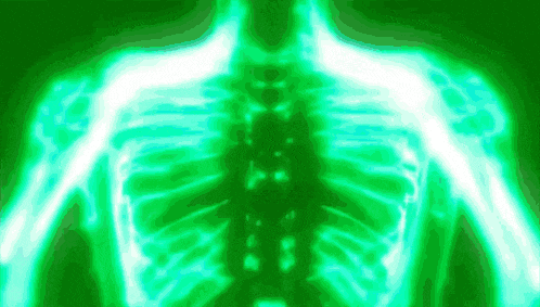 an x-ray of a person 's skeleton is glowing in green