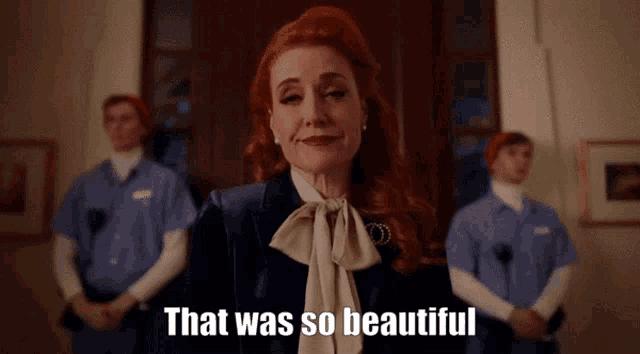 a woman with red hair says that was so beautiful in front of a group of people