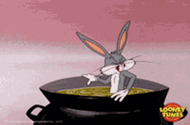 bugs bunny from looney tunes is sitting in a pan of soup