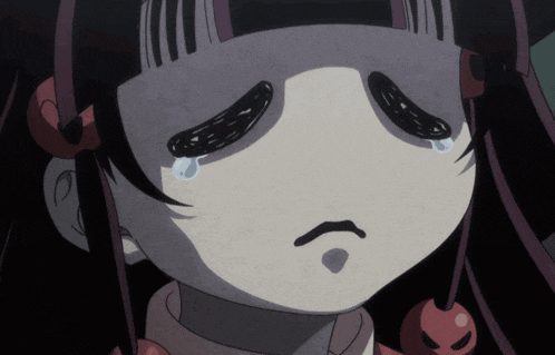 a close up of a cartoon character with a tear coming out of her eye