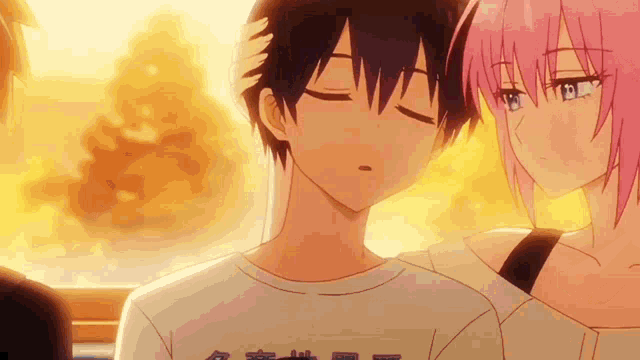 a boy and a girl are standing next to each other and the girl is touching the boy 's head .