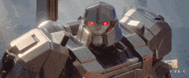 a close up of a robot with red eyes and the letter o on its chest