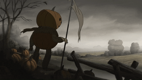 a scarecrow in a pumpkin costume stands in a field