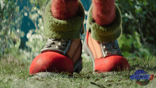 a close up of a person 's feet with a sonic 3 logo in the corner