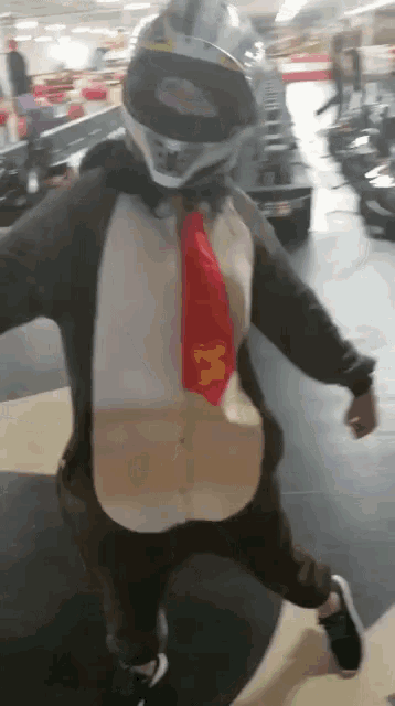 a person wearing a helmet and a tie is dressed as a monkey