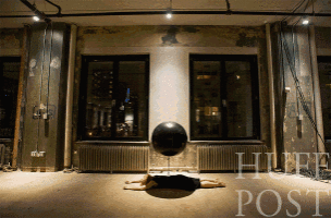 a person is laying on the floor in front of a large window with the word post on the bottom