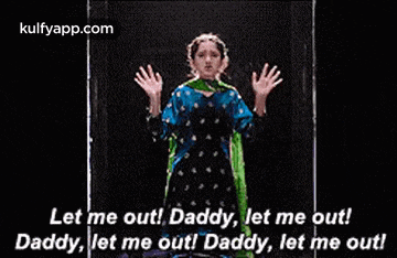 a girl in a blue and green dress is standing in a doorway with her hands outstretched and says let me out