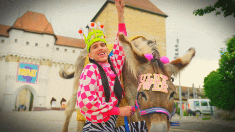 a man is riding a donkey with a sign that says ulez power on it