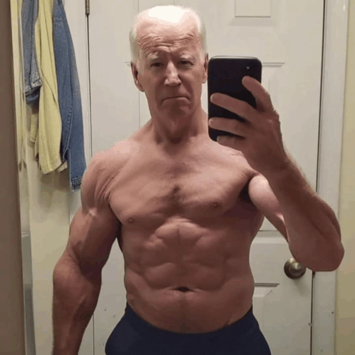 a shirtless man is taking a selfie with his cell phone