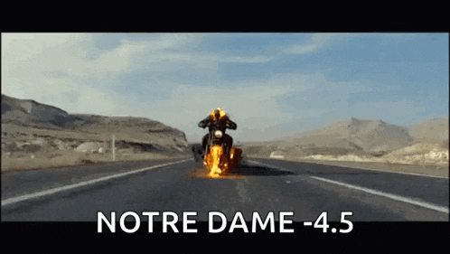 a person is riding a motorcycle down a highway with the words notre dame -4.5 below them
