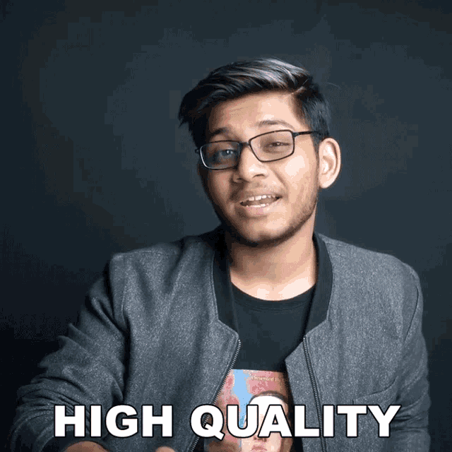 a young man wearing glasses and a t-shirt that says high quality