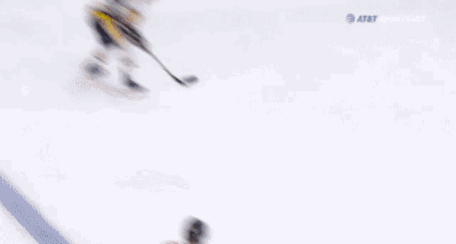 a blurry picture of a hockey game being broadcasted by sportsnet