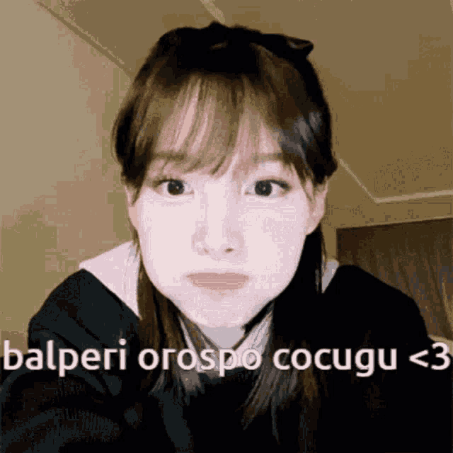 a close up of a girl 's face with the words calperi orospo cocugu written on the bottom