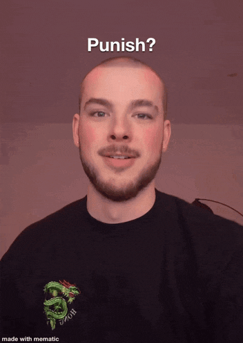 a man with a beard wearing a black shirt with a dragon on it