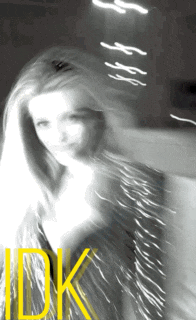 a blurry picture of a woman with the word idk on the bottom