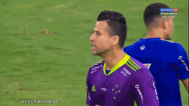 a soccer player wearing a purple jersey that says prisma sacol