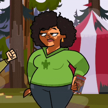 a woman in a green sweater with a turtle on it stands in front of a tent