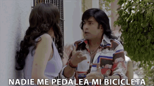 a man talking to a woman with the words " nadie me pedalea mi bicicleta " written below him