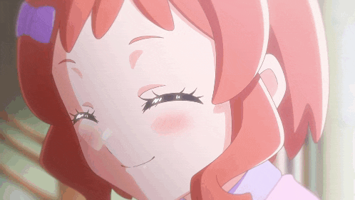a close up of a girl with red hair