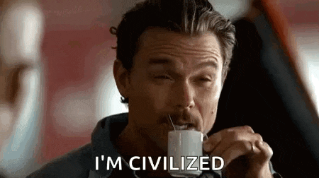 a man with a mustache is drinking a cup of coffee and says `` i 'm civilized '' .