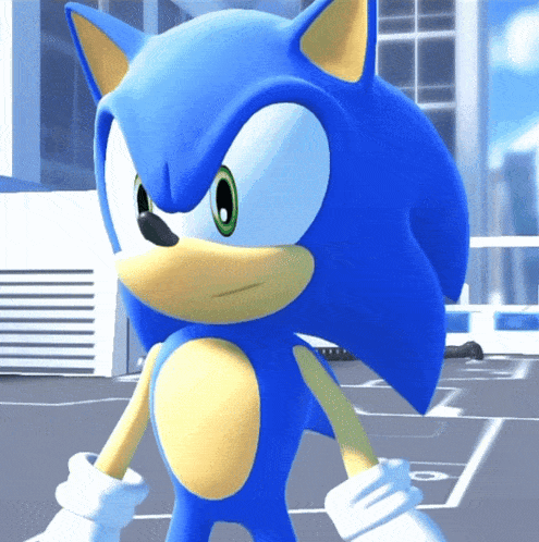 a close up of a sonic the hedgehog standing in front of a building