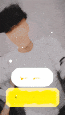 a man laying on a bed with a yellow and white speech bubble above him