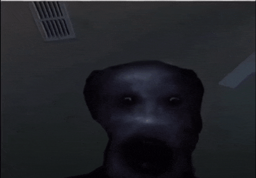 a very scary face with a very large mouth is in a dark room