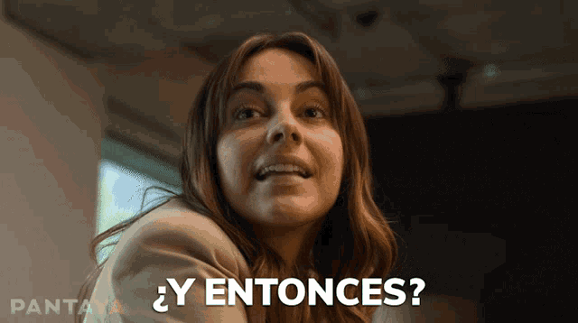 a woman says " y entonces " while smiling