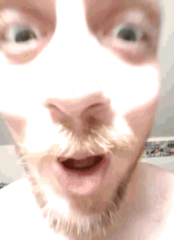 a close up of a man 's face with a mask on it