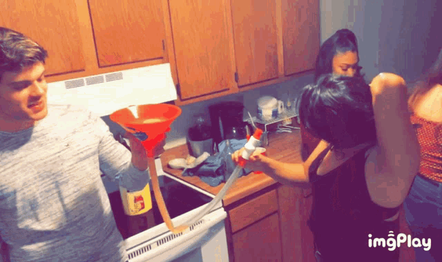 a man is pouring something into a funnel that has a bottle of coca cola on it